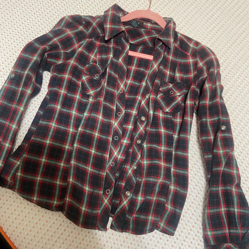Flannel size medium, fits like a small.